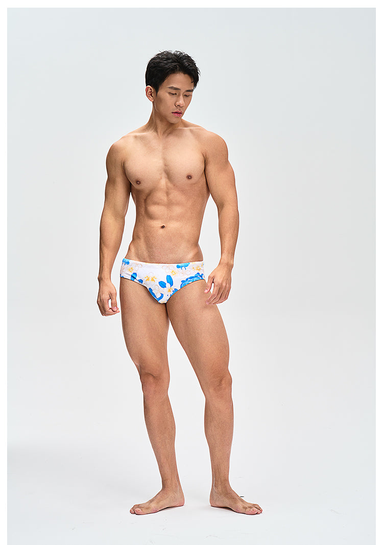 UPRO men's Frangipani Swim Brief – Blue Yellow Floral – studio model view, photo 1 of 3