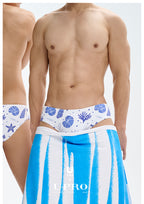 UPRO men's Shell Print Swim Brief – White Blue Shell – studio fit detail, photo 1 of 2