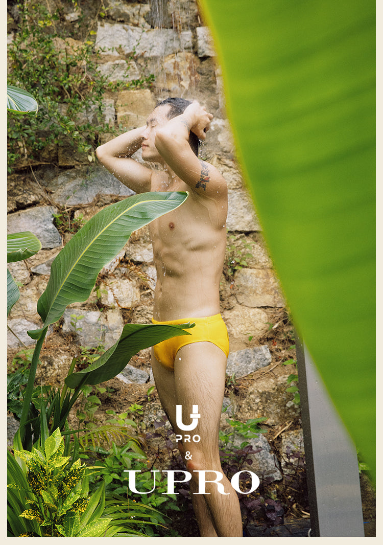 UPRO men's Yellow Logo Swim Brief – Yellow – outdoor campaign photo, photo 1 of 5