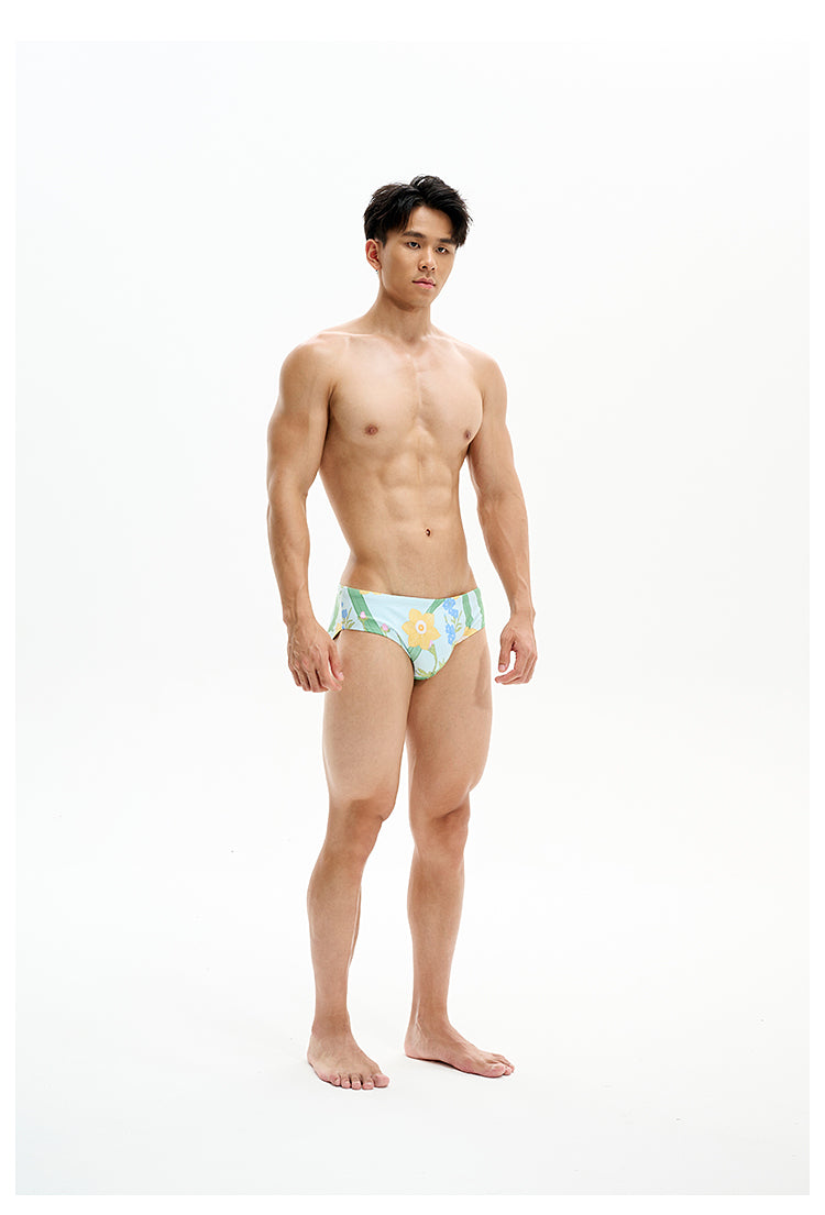 UPRO men's Narcissus Print Swim Brief – Green Floral – studio model view, photo 1 of 3