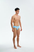 UPRO men's Daisy Print Swim Brief – Blue Daisy – studio three-quarter view