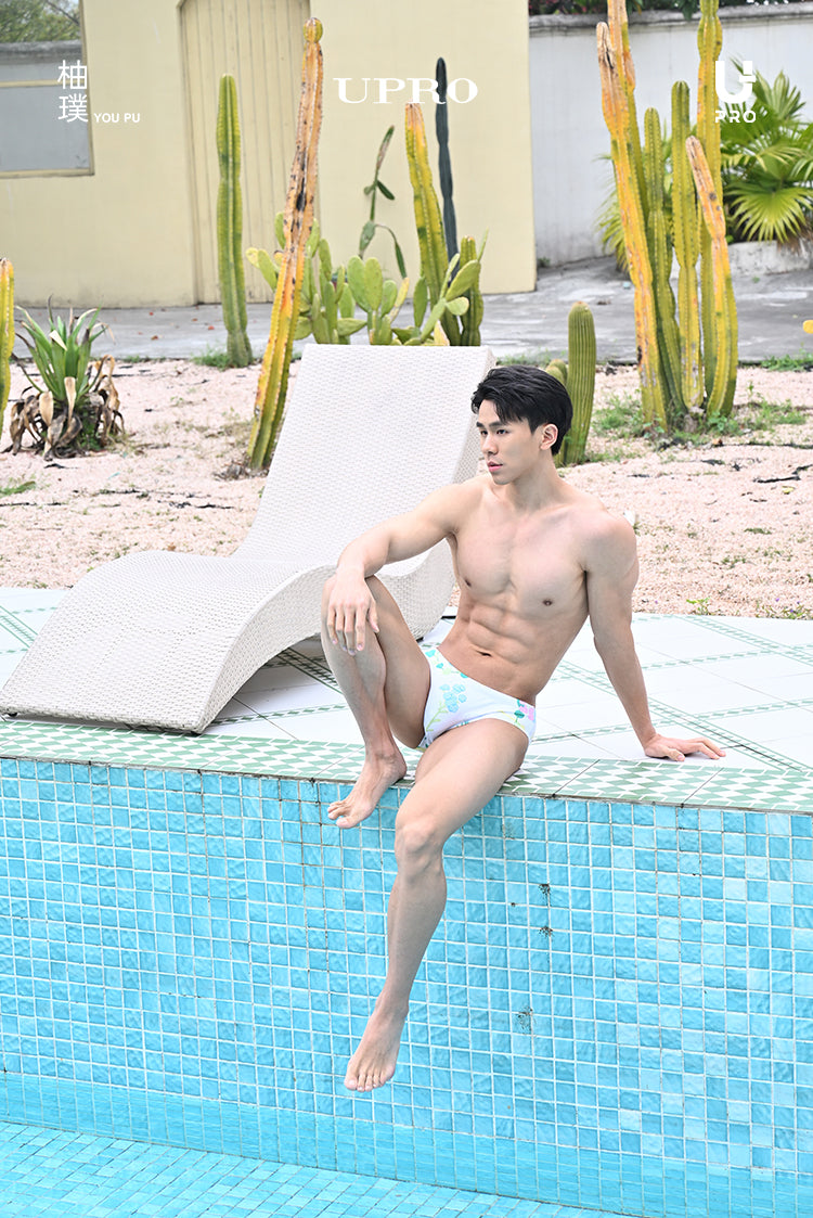 UPRO men's Stephania Plant Print Swim Brief – White Green Botanical – outdoor campaign photo, photo 1 of 2