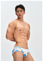 UPRO men's Frangipani Swim Brief – Blue Yellow Floral – studio fit detail, photo 1 of 2