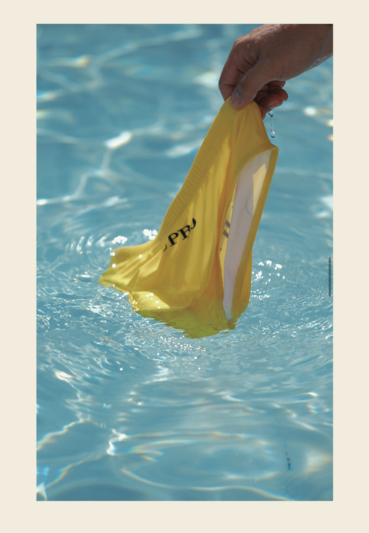 UPRO Slip de bain homme jaune avec logo – détail de fabrication