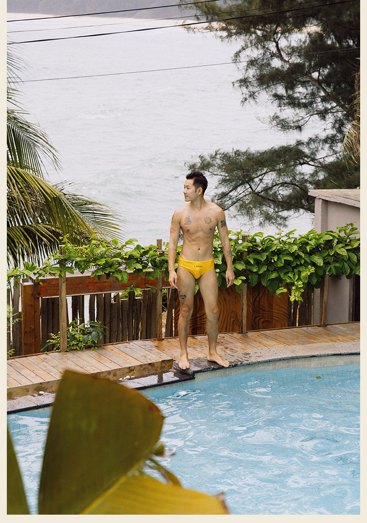 UPRO men's Yellow Logo Swim Brief – Yellow – outdoor campaign photo, photo 4 of 5