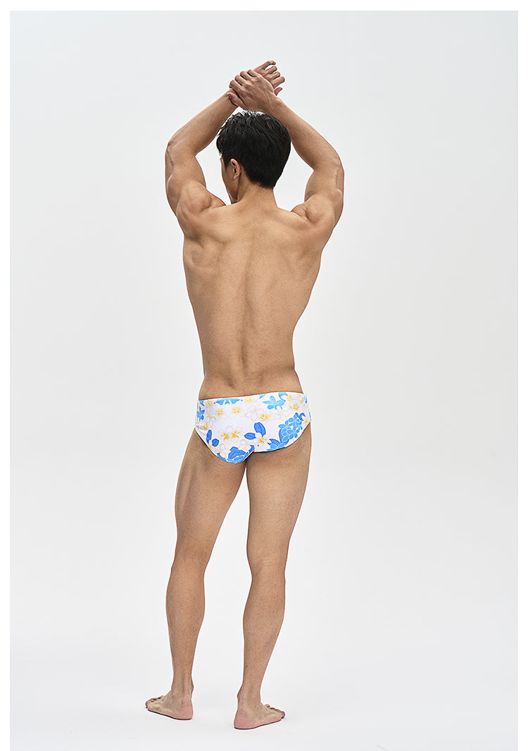 UPRO men's Frangipani Swim Brief – Blue Yellow Floral – studio model view, photo 2 of 3