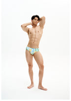 UPRO men's Narcissus Print Swim Brief – Green Floral – studio model view, photo 2 of 3