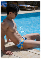 UPRO men's Bird of Paradise Print Swim Brief – Blue Orange Botanical – outdoor campaign photo, photo 1 of 3